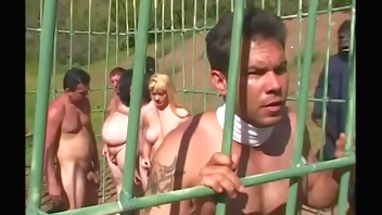 Young redhead wirth small tits Flick Shagwell and a dude fuck in a cage outdoors on the planet of monkeys